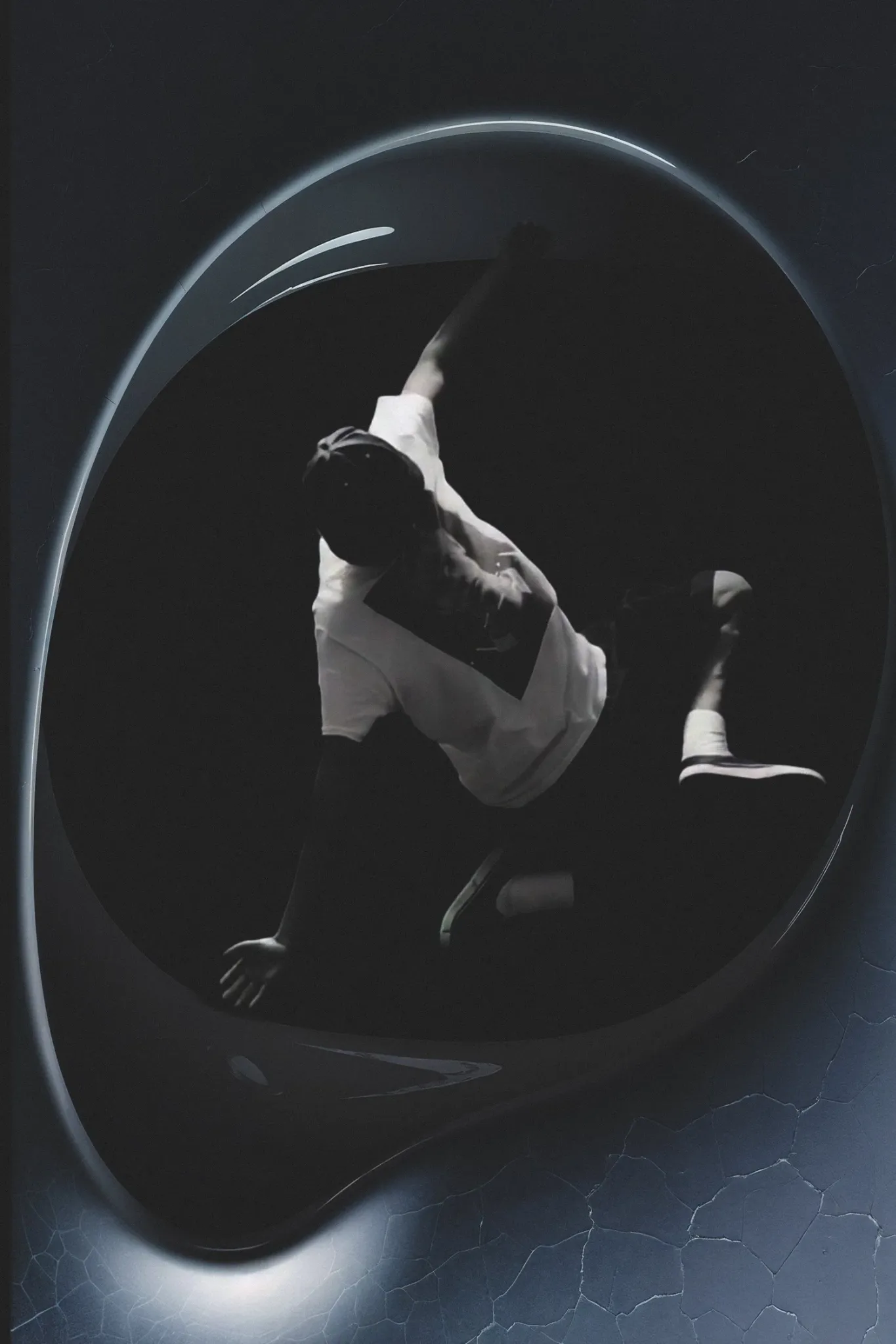 A figure in movement, framed by an arc of light