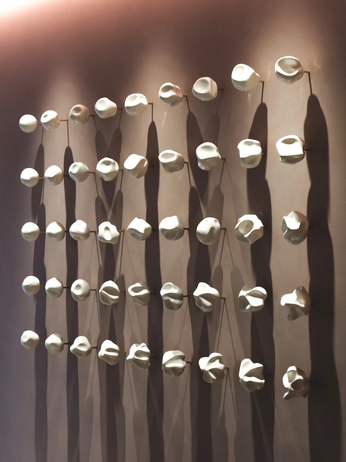 An oblique view of the Accretions wall sculpture