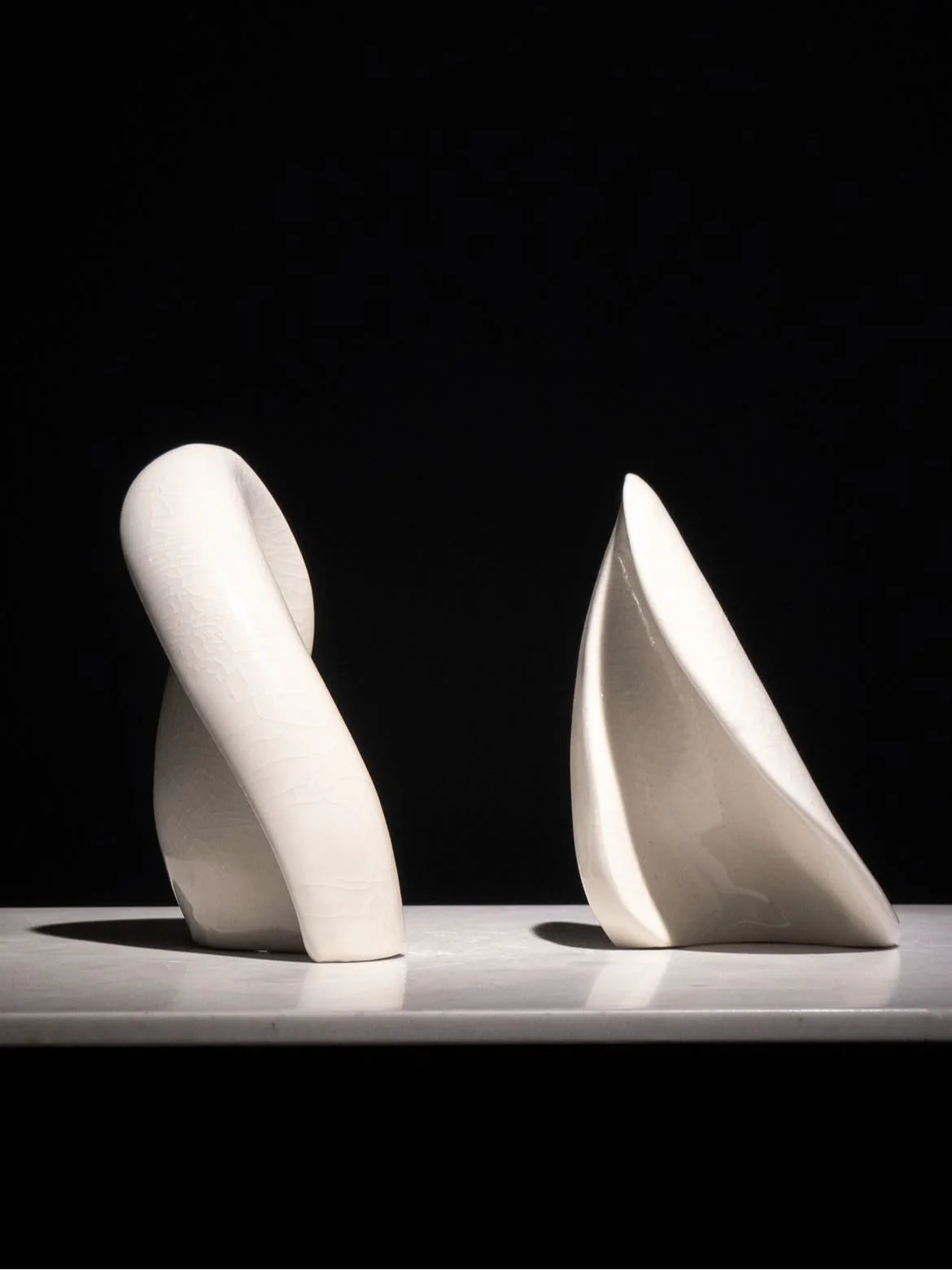 A second view of the curved white ceramic forms